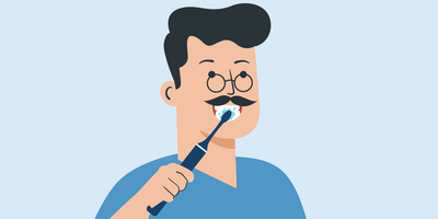 how should you hold the toothbrush during brushing