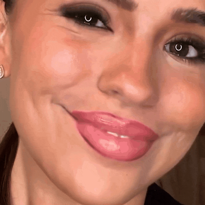 Woman smiling after rinsing